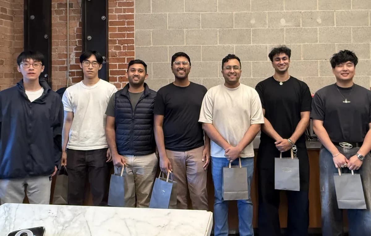 Team members with bags of handmade chocolates